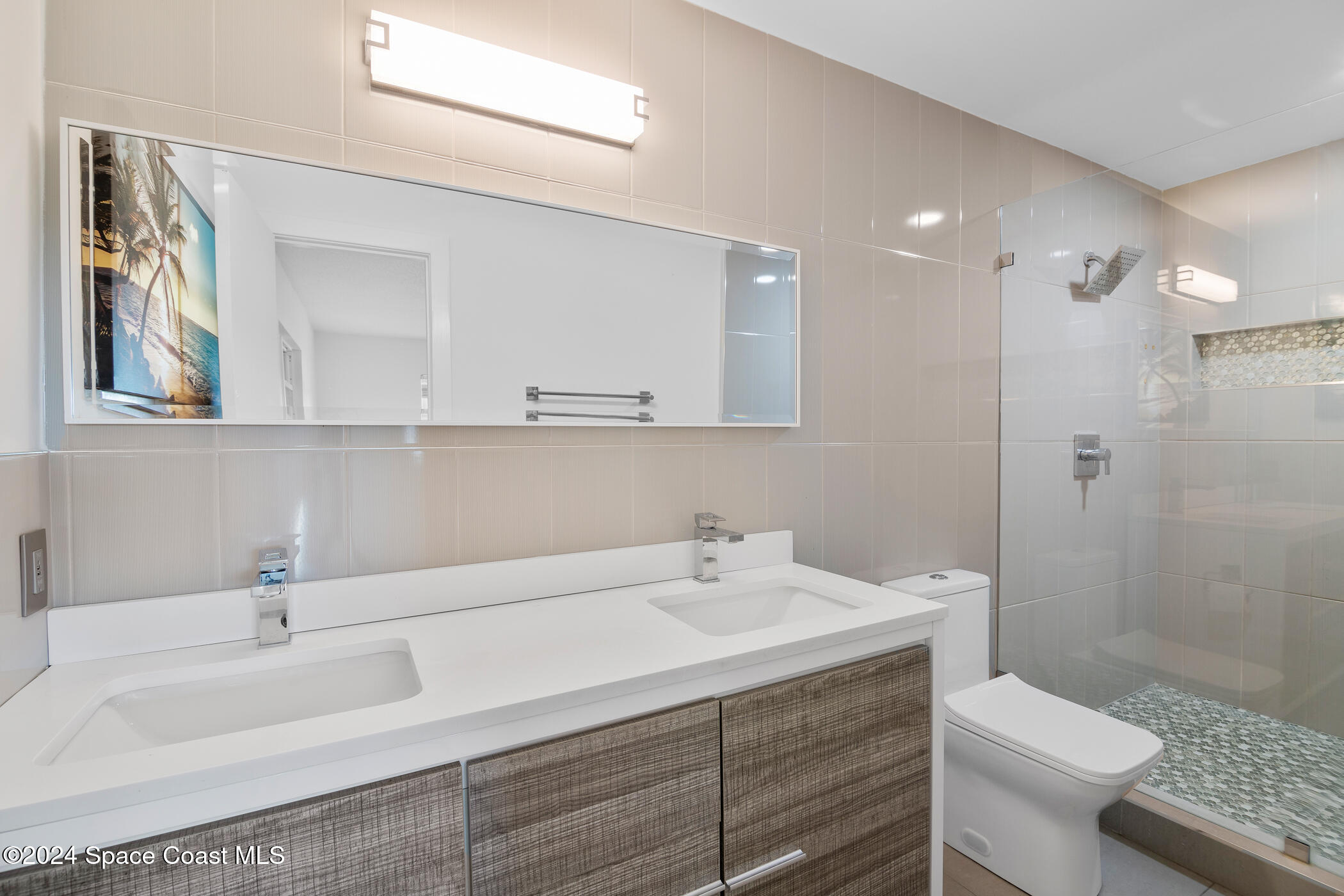 360 East Riviera Boulevard Indialantic, FL 32903 - Photo 15 of 26 a bathroom with a sink a toilet and shower