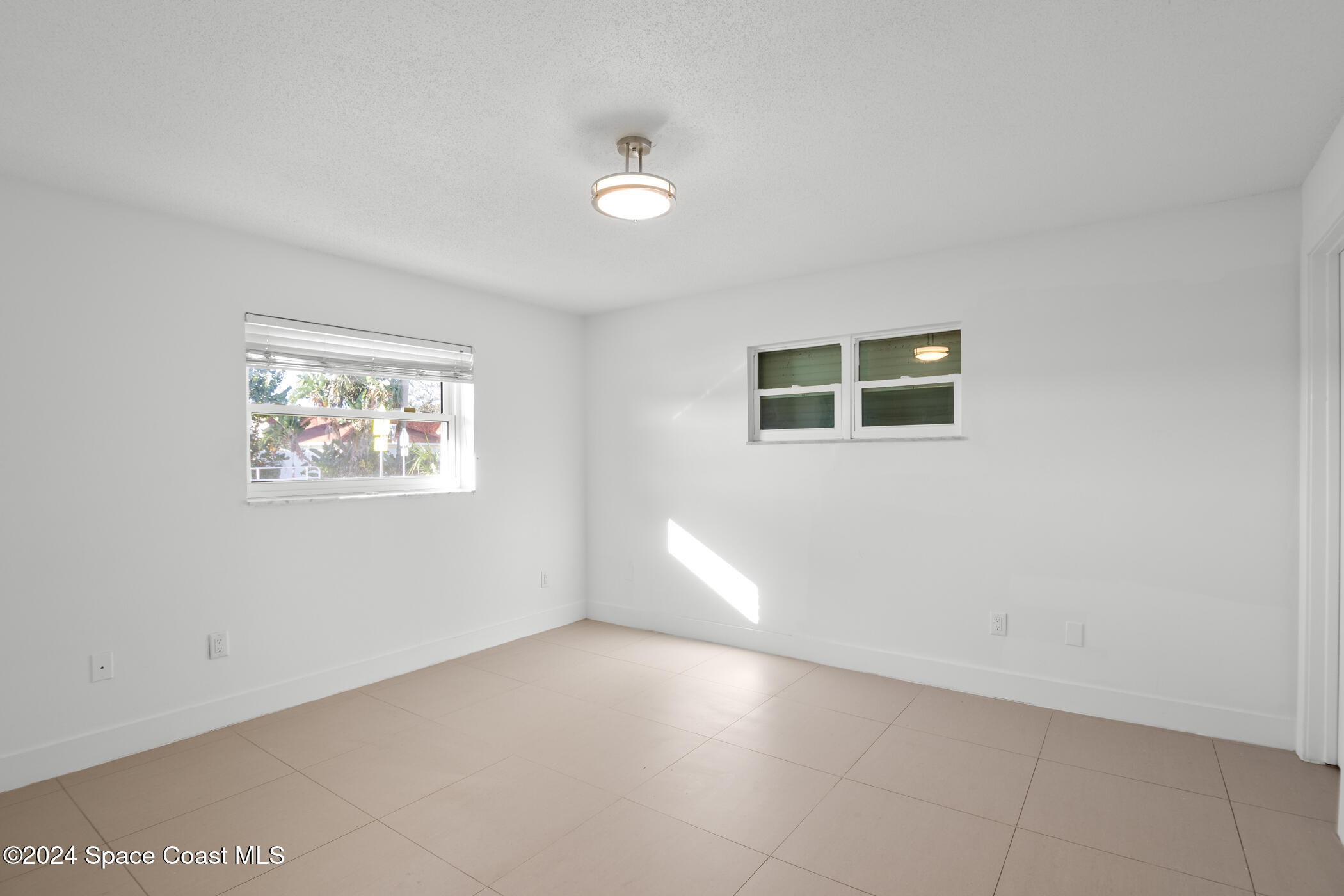 360 East Riviera Boulevard Indialantic, FL 32903 - Photo 17 of 26 a view of an empty room with a window