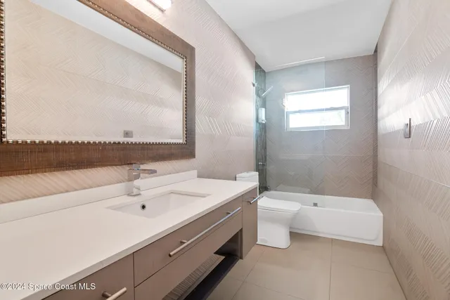 a livingroom with furniture and a large window