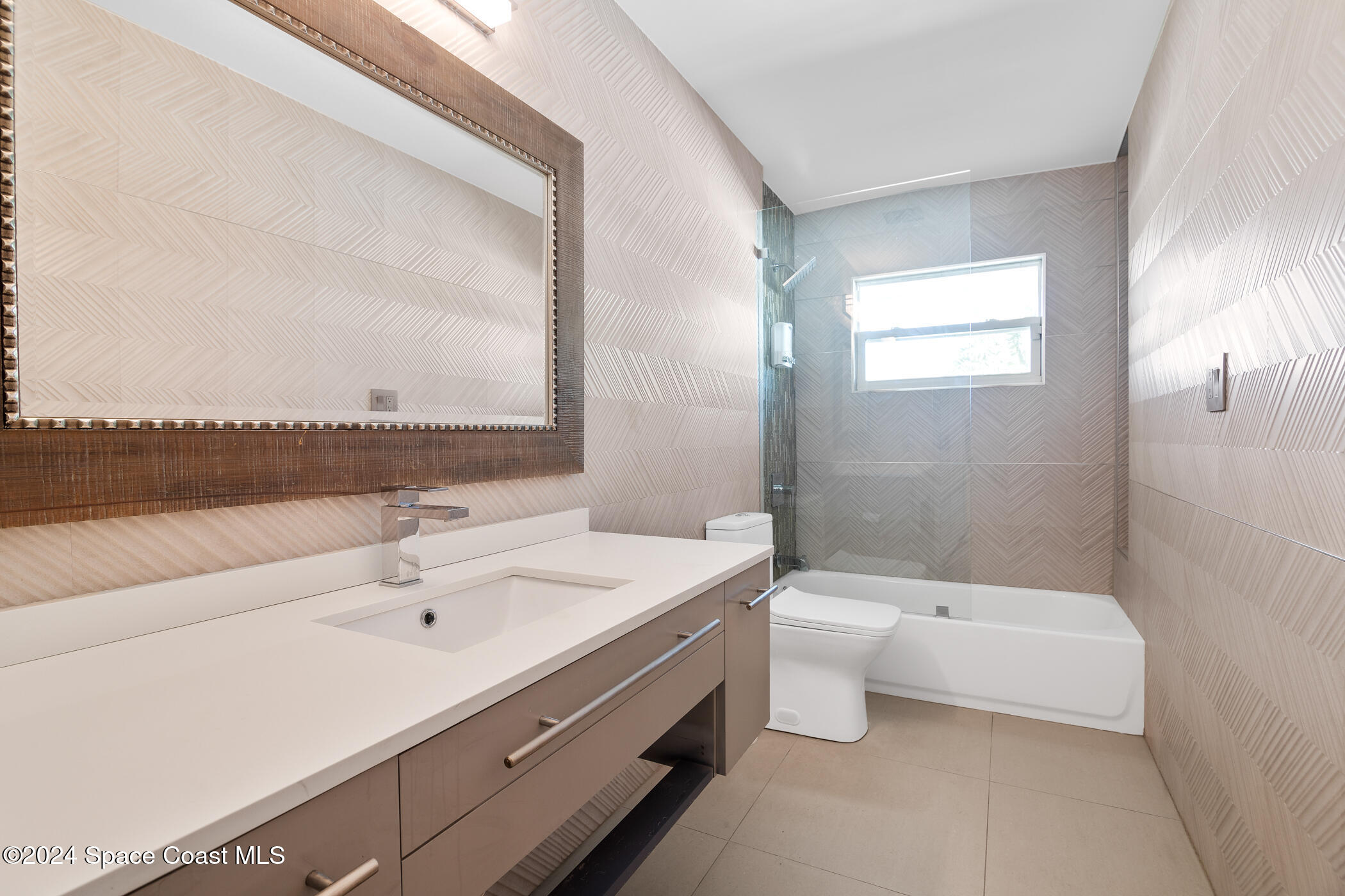 360 East Riviera Boulevard Indialantic, FL 32903 - Photo 18 of 26 a bathroom with a double vanity sink toilet and a bathtub