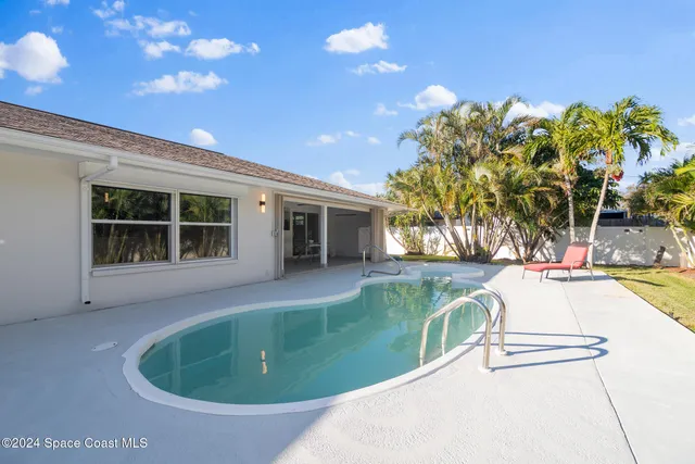 a view of a house with a tree