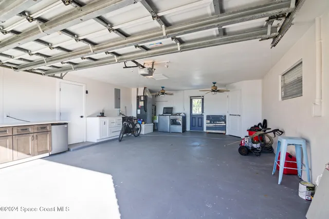a view of a swimming pool with a patio and a yard