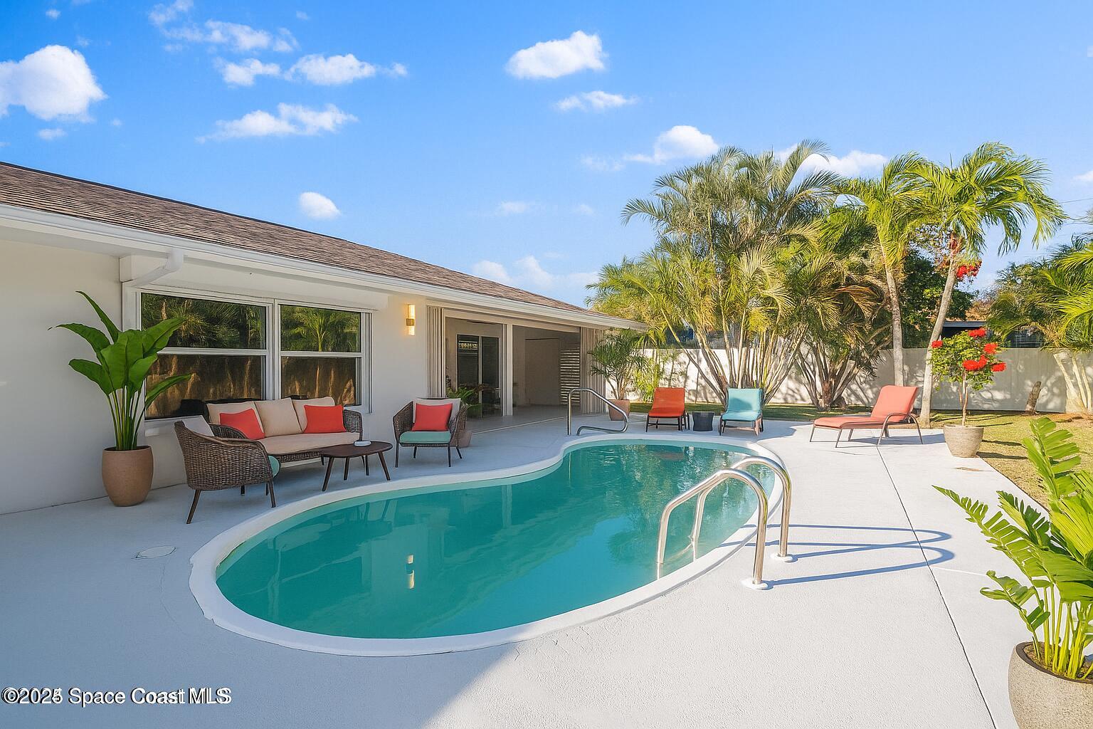 360 East Riviera Boulevard Indialantic, FL 32903 - Photo 26 of 26 a view of a swimming pool with a patio and a yard