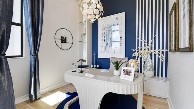 a dining room with furniture and window