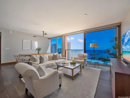 a living room with furniture and a large window
