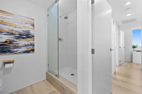 a bathroom with a shower and a sink