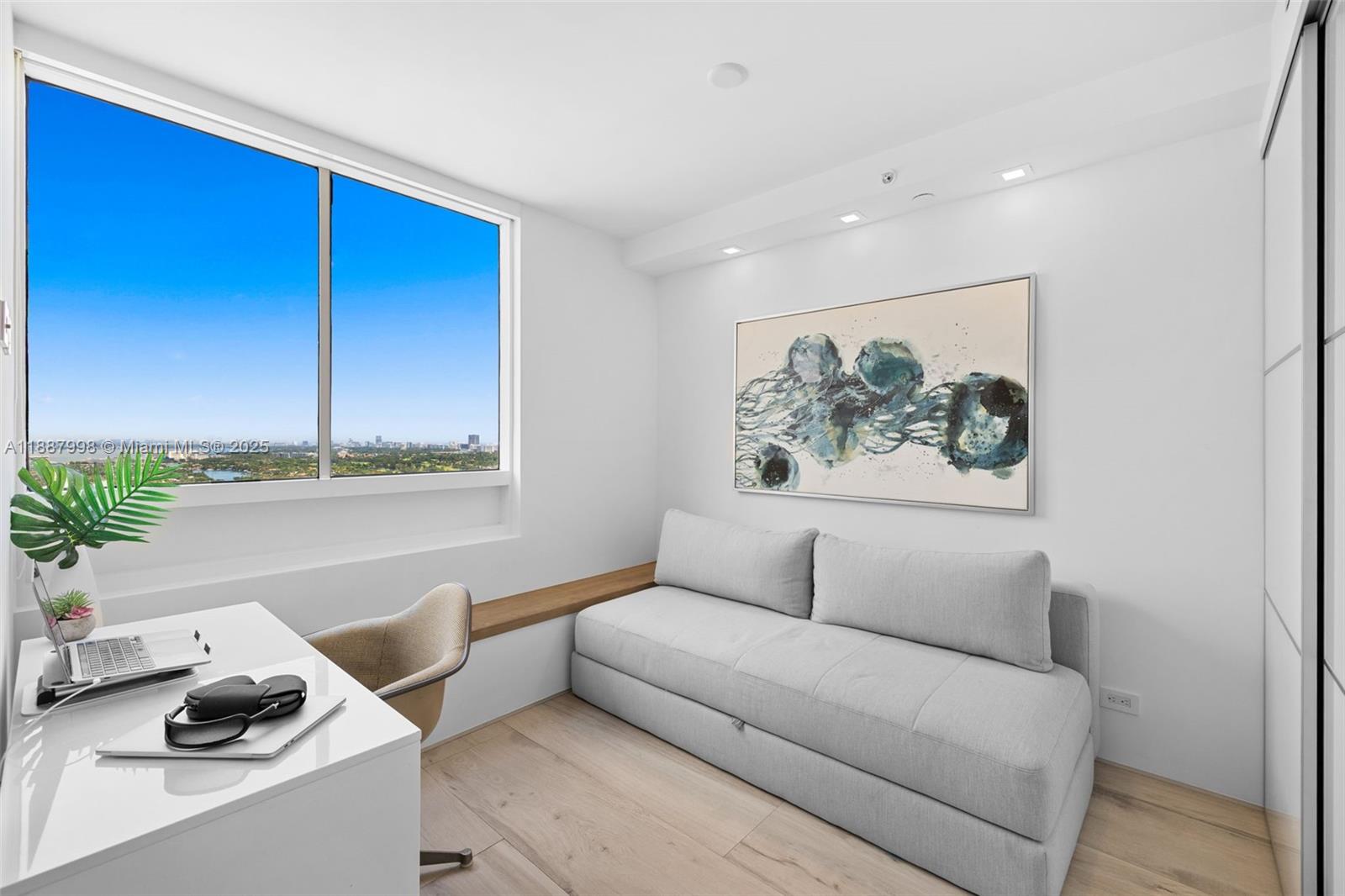 1330 West Avenue, Unit 3407 Miami Beach, FL 33139 - Photo 18 of 42 a living room with furniture and a potted plant