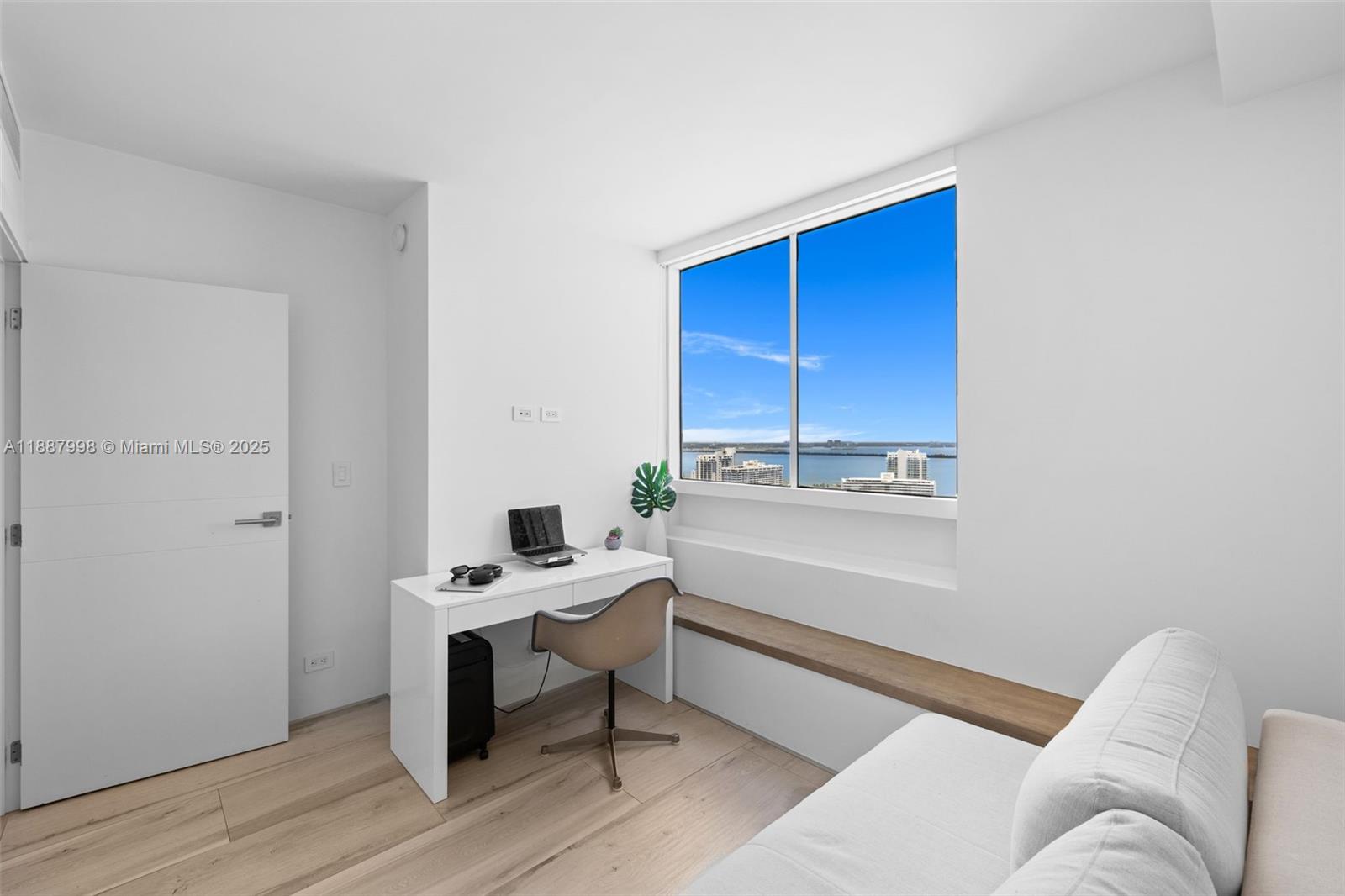 1330 West Avenue, Unit 3407 Miami Beach, FL 33139 - Photo 19 of 42 a room with a couch and a window