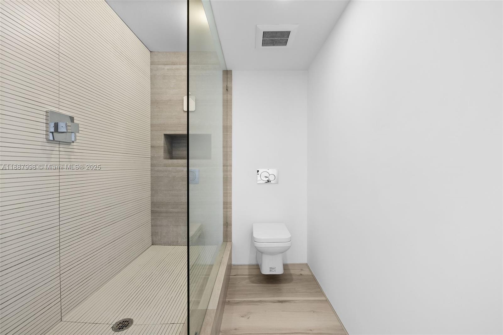 1330 West Avenue, Unit 3407 Miami Beach, FL 33139 - Photo 25 of 42 a bathroom with a toilet and a shower