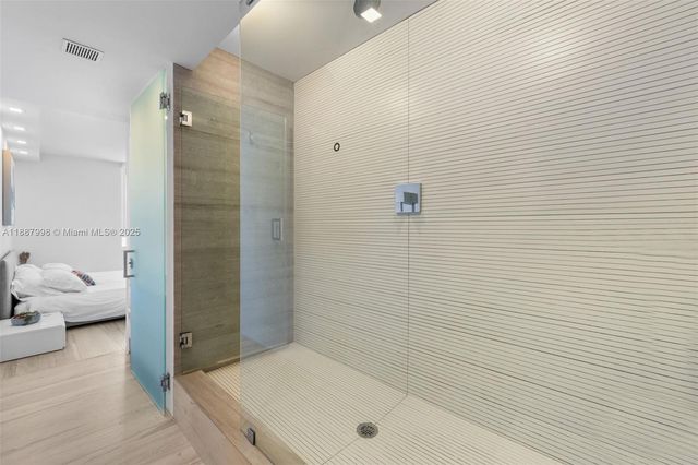 a bathroom with a tub and a shower