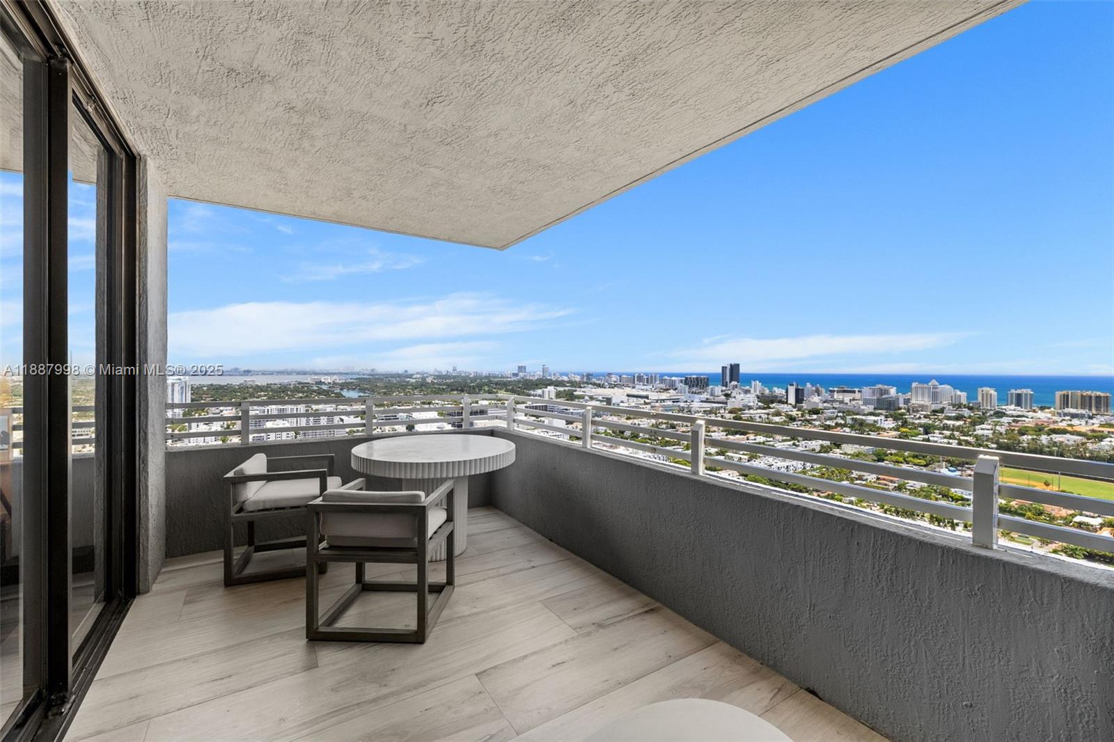 1330 West Avenue, Unit 3407 Miami Beach, FL 33139 - Photo 27 of 42 a view of a terrace with a table and chairs