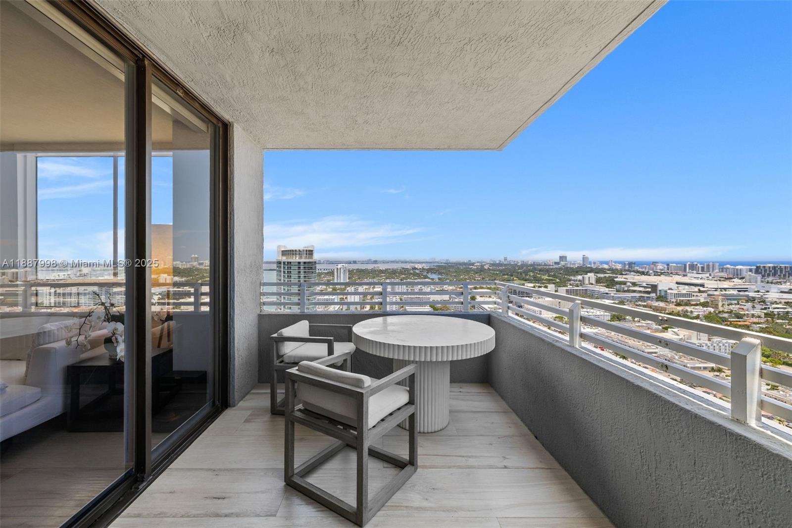 1330 West Avenue, Unit 3407 Miami Beach, FL 33139 - Photo 28 of 42 a view of a balcony with chairs and a table