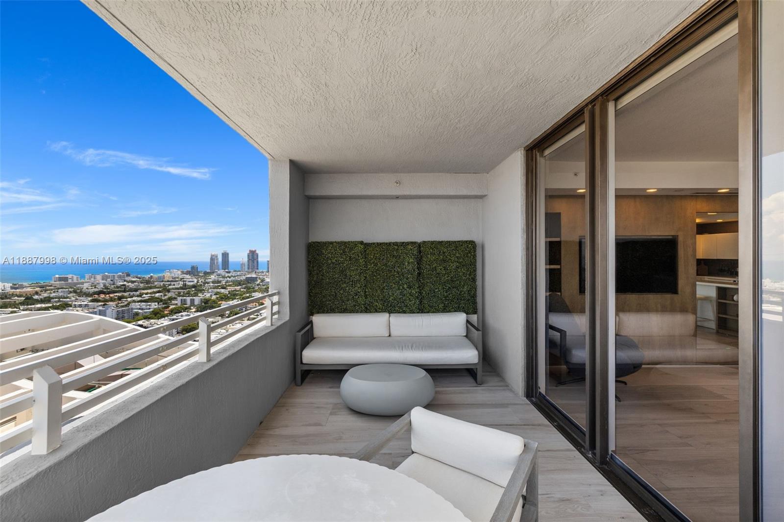 1330 West Avenue, Unit 3407 Miami Beach, FL 33139 - Photo 34 of 42 a living room with furniture and a floor to ceiling window