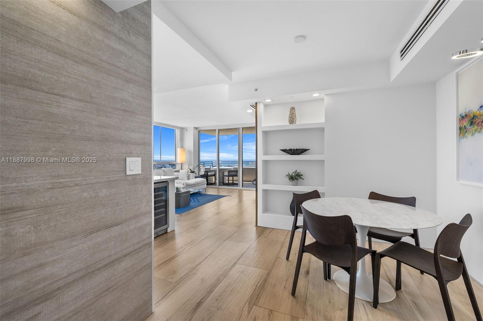1330 West Avenue, Unit 3407 Miami Beach, FL 33139 - Photo 38 of 42 a view of a dining room with furniture and wooden floor
