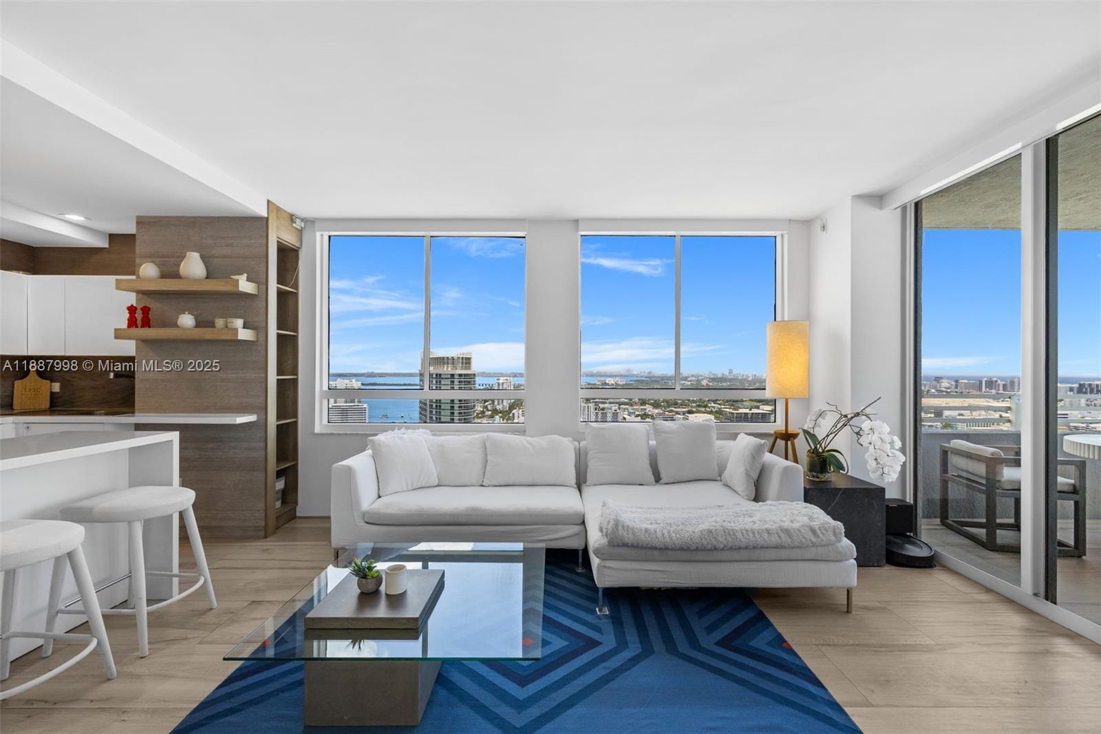 1330 West Avenue, Unit 3407 Miami Beach, FL 33139 - Photo 4 of 42 a living room with furniture and a large window