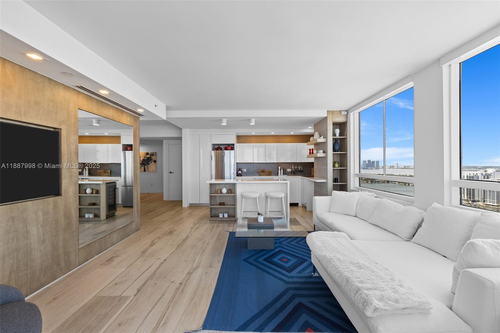 1330 West Avenue, Unit 3407 Miami Beach, FL 33139 - Photo 6 of 42 a living room with furniture and a flat screen tv