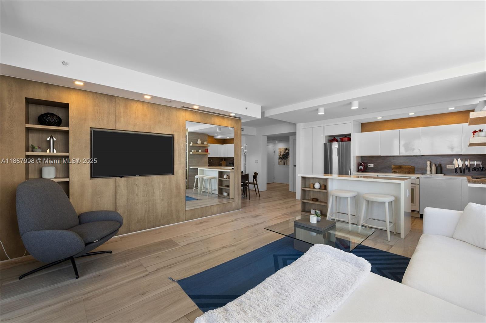 1330 West Avenue, Unit 3407 Miami Beach, FL 33139 - Photo 7 of 42 a living room with furniture and a flat screen tv