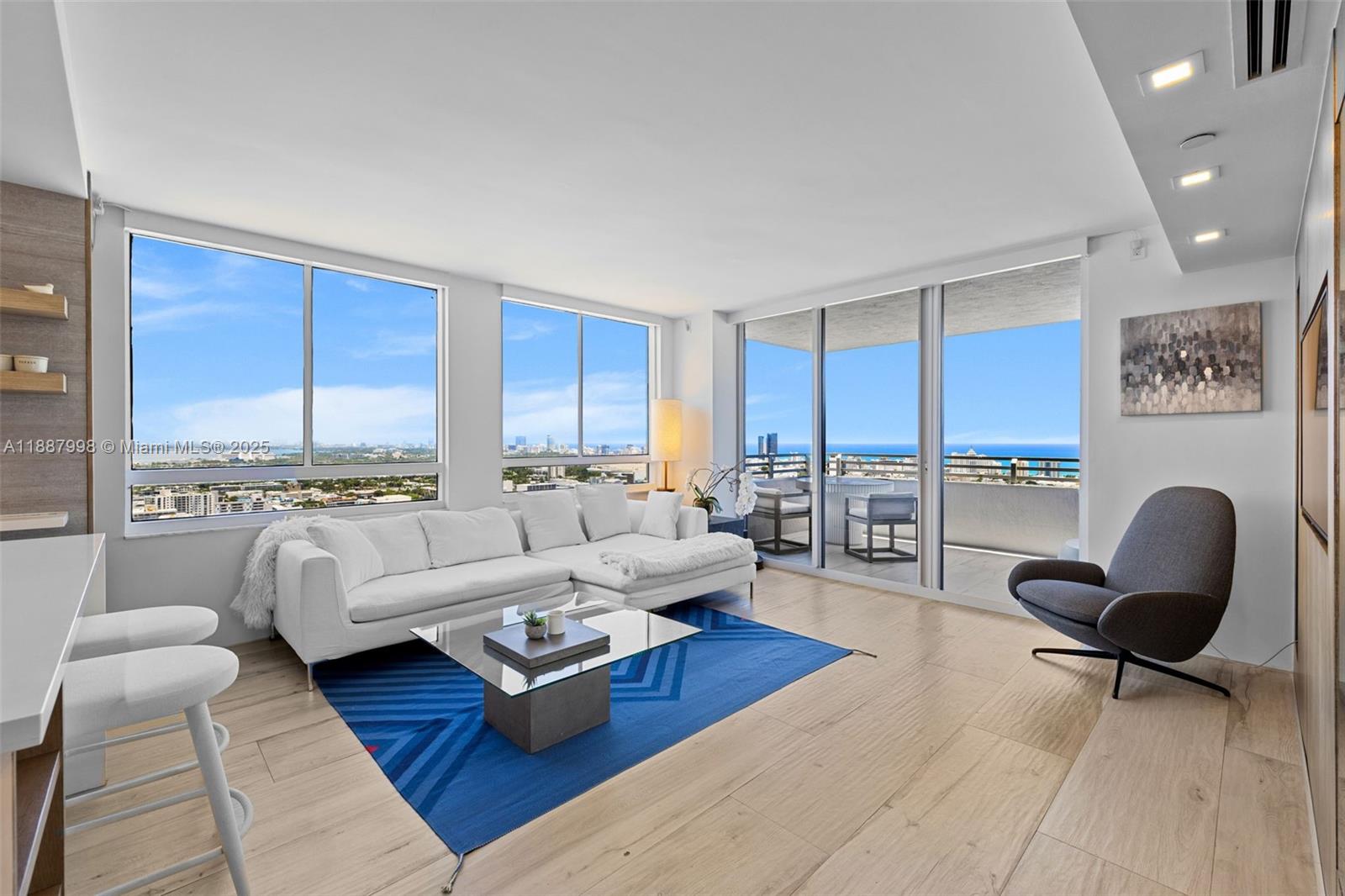 1330 West Avenue, Unit 3407 Miami Beach, FL 33139 - Photo 9 of 42 a living room with furniture and a large window
