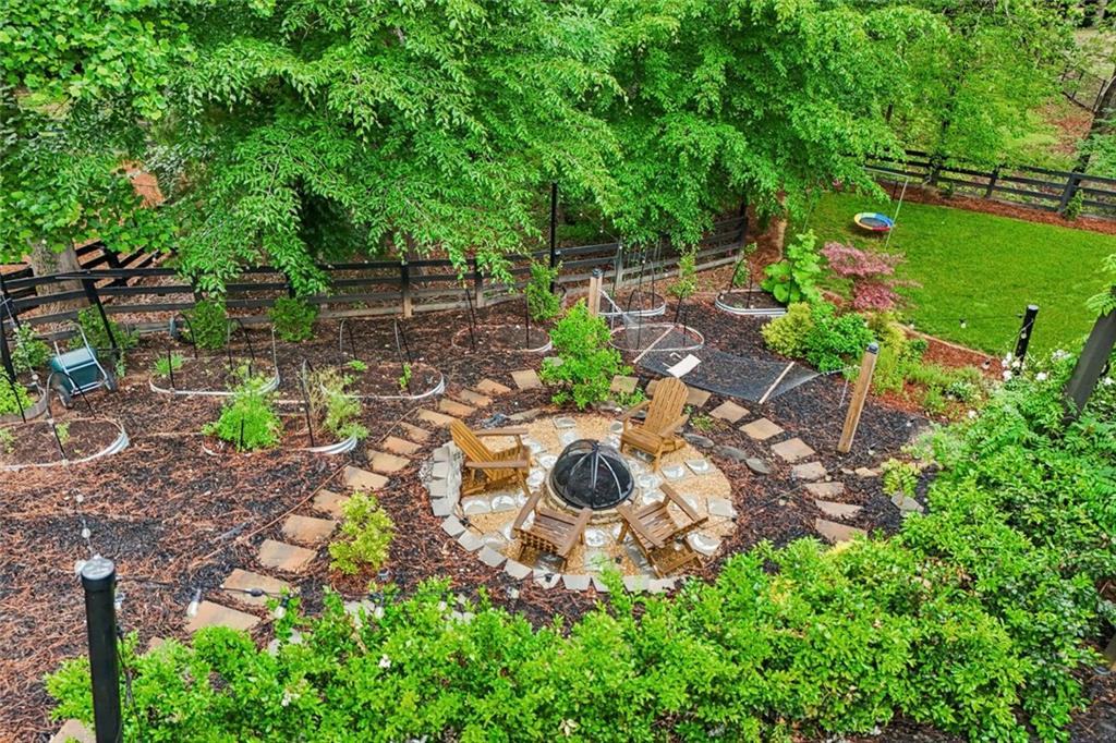 1091 Fieldstone Trail Milton, GA 30004 - Photo 79 of 84 a backyard of a house with a garden and outdoor seating