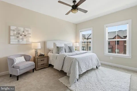 a bedroom with bed and window