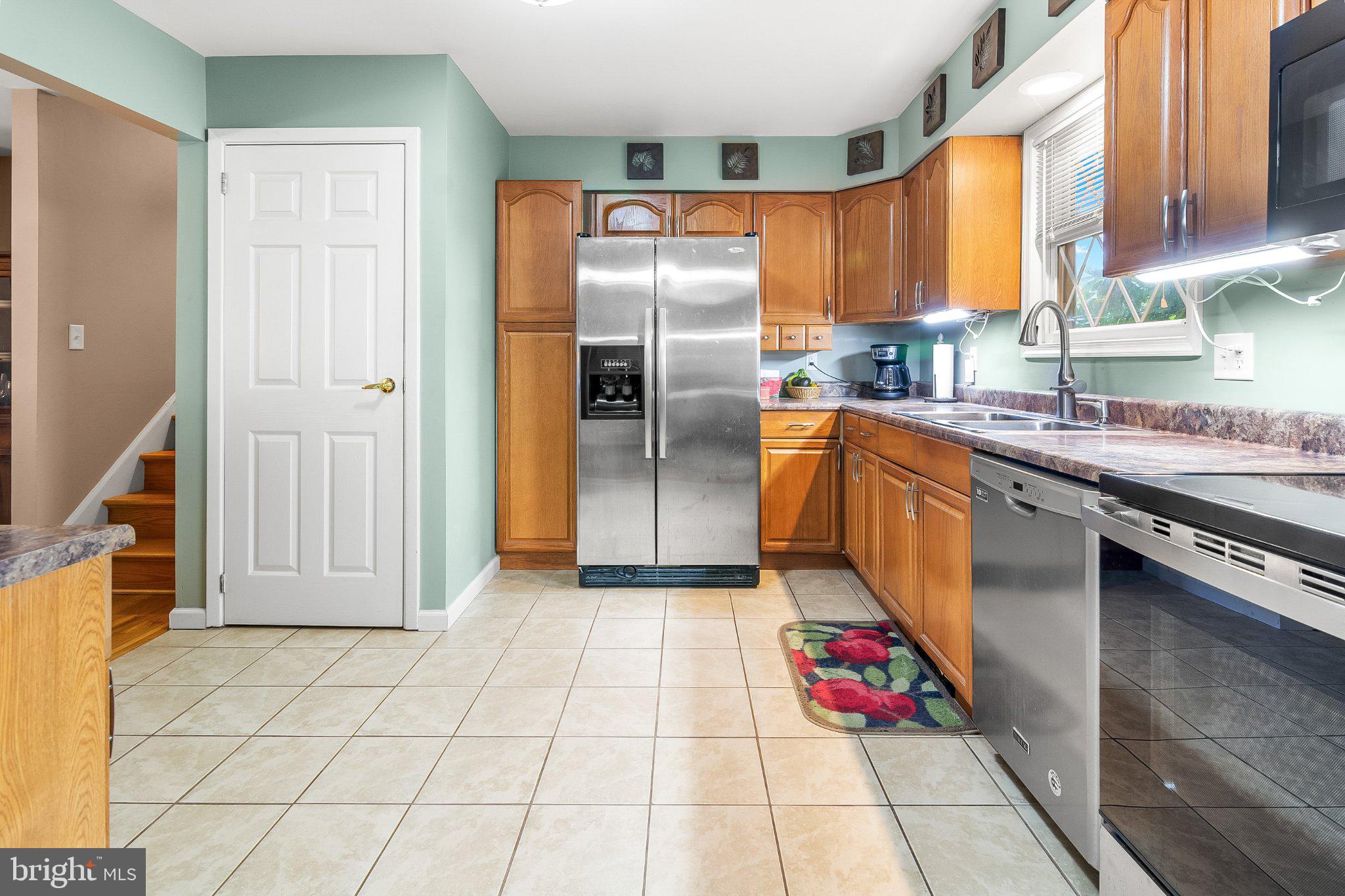 5412 Ridge Road Mount Airy, MD 21771 - Photo 10 of 38 Modern kitchen with warm wood accents.