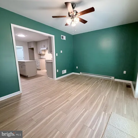 a view of a kitchen from the hallway