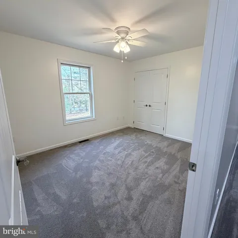a bathroom with a double vanity sink and mirror
