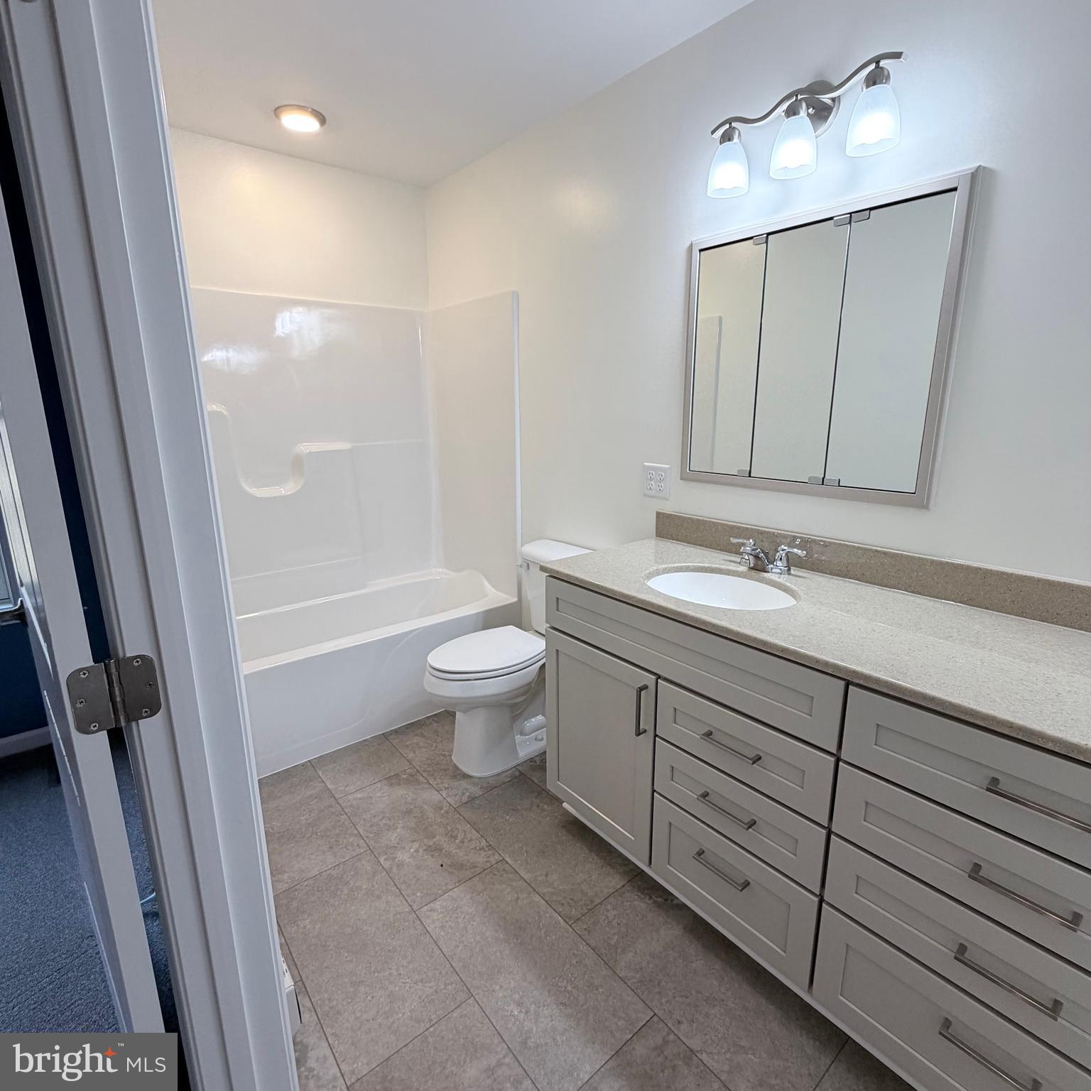 155 Buchanan Valley Road Orrtanna, PA 17353 - Photo 34 of 61 a bathroom with a double vanity sink a toilet and a mirror