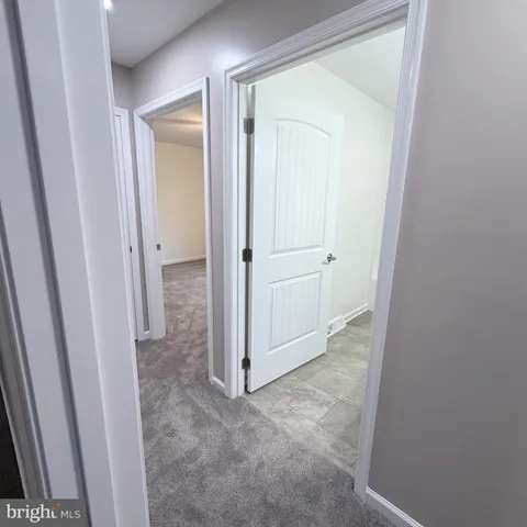 a backyard of a house with large trees