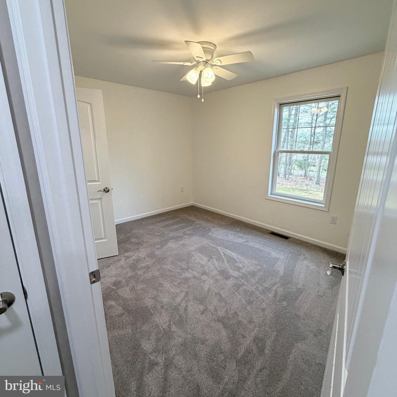 155 Buchanan Valley Road Orrtanna, PA 17353 - Photo 43 of 61 an empty room with windows and fan