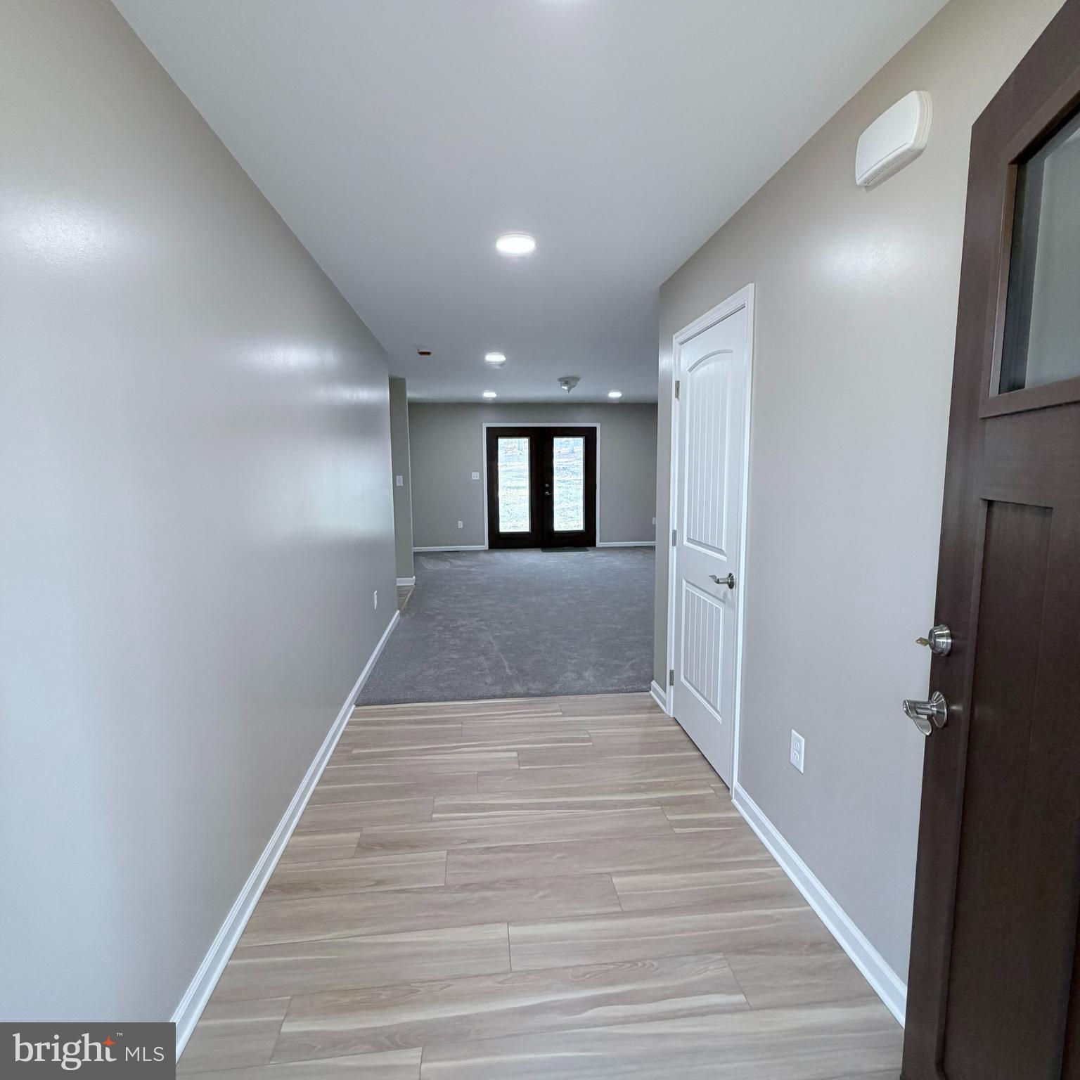 155 Buchanan Valley Road Orrtanna, PA 17353 - Photo 7 of 61 a view of a hallway with wooden floor and a fireplace