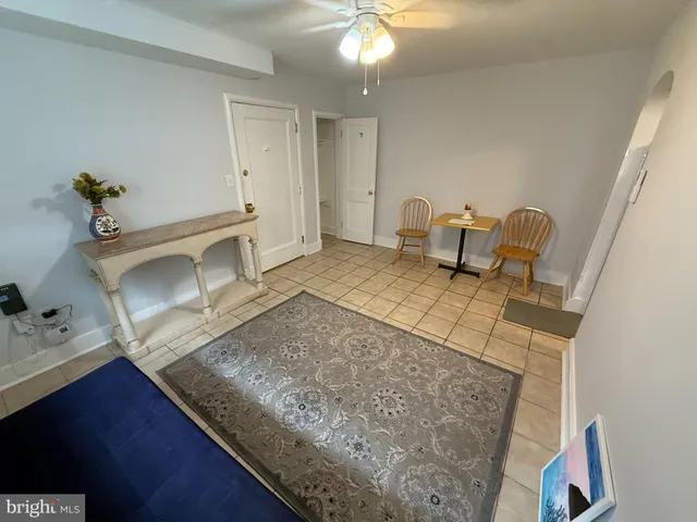 a living room with furniture and a rug