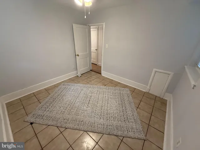 an empty room with wooden floor