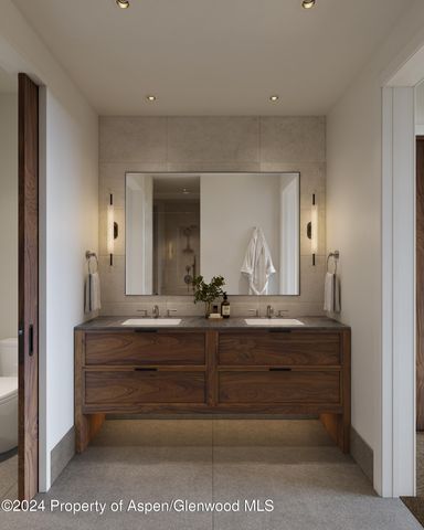 a view of mirror light fixtures and entryway