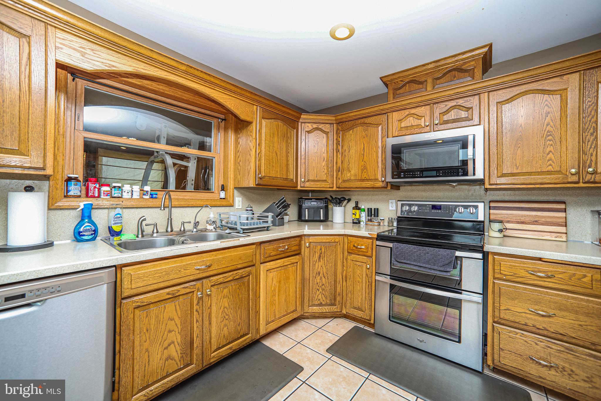 345 Kauffroth Road Narvon, PA 17555 - Photo 22 of 88 a kitchen with stainless steel appliances granite countertop a stove microwave and cabinets