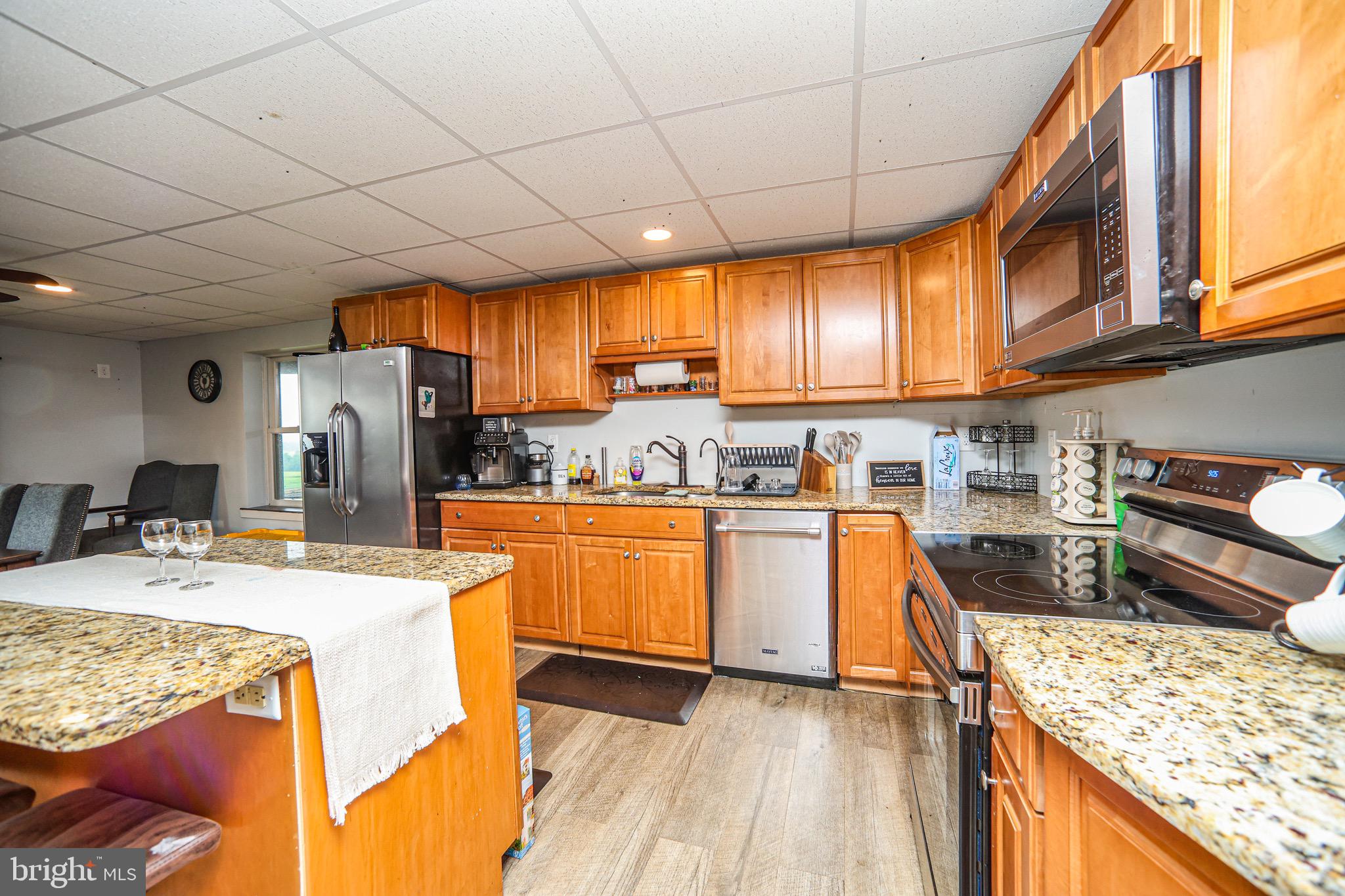 345 Kauffroth Road Narvon, PA 17555 - Photo 43 of 88 a kitchen with stainless steel appliances granite countertop a sink stove and refrigerator