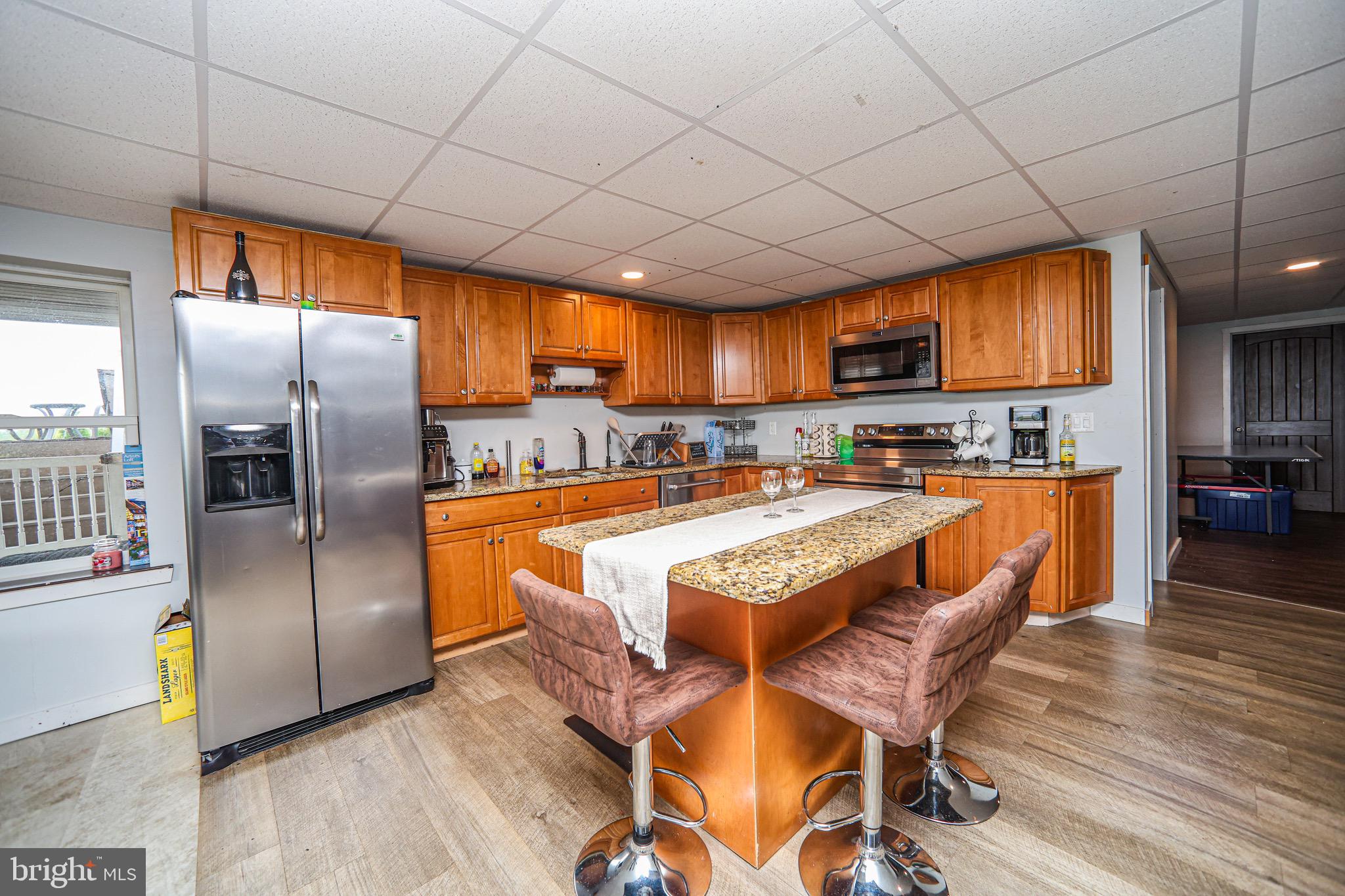 345 Kauffroth Road Narvon, PA 17555 - Photo 45 of 88 a kitchen with stainless steel appliances granite countertop a refrigerator a sink a stove and a refrigerator