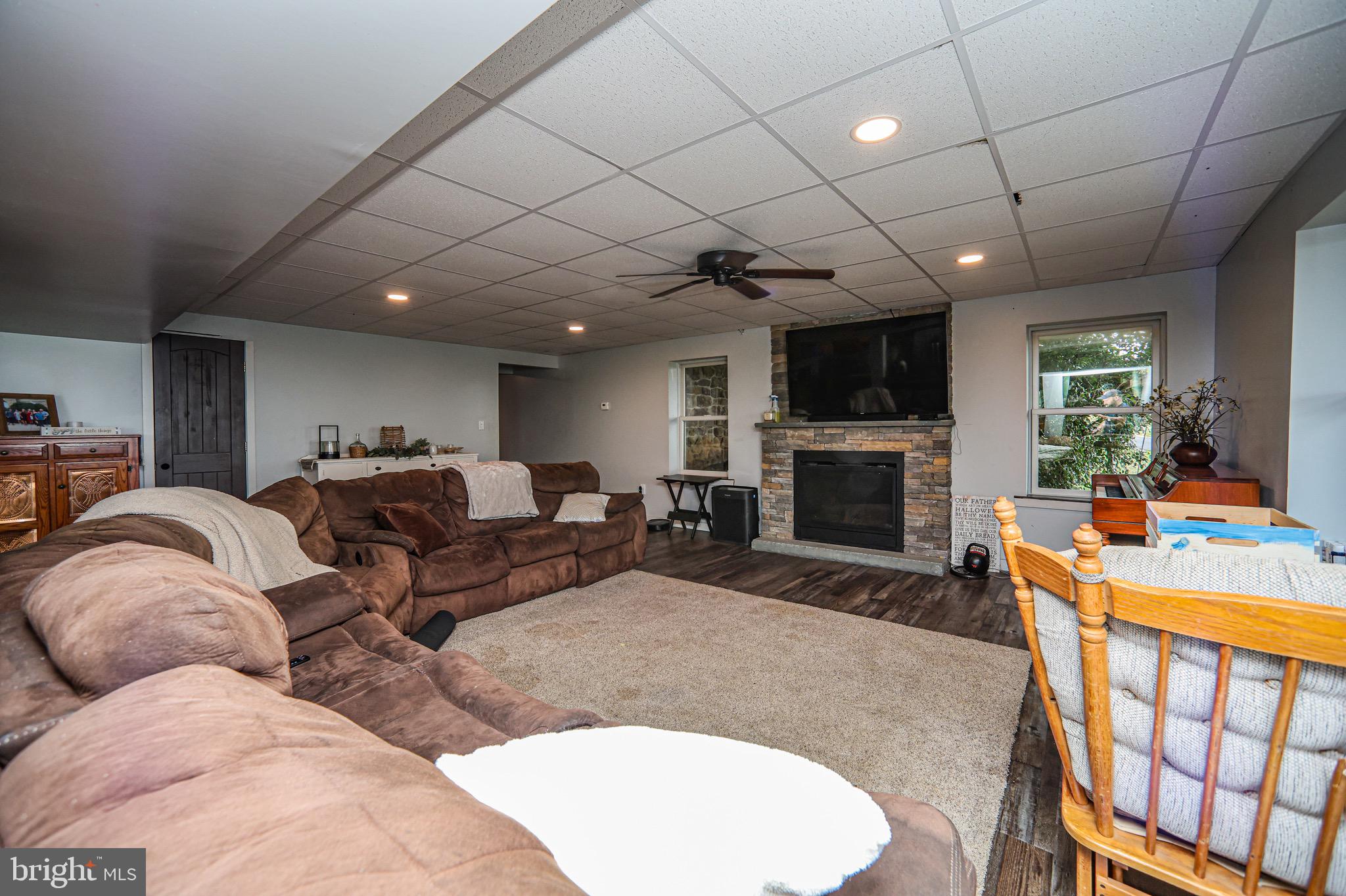 345 Kauffroth Road Narvon, PA 17555 - Photo 48 of 88 a living room with furniture a flat screen tv and a fireplace