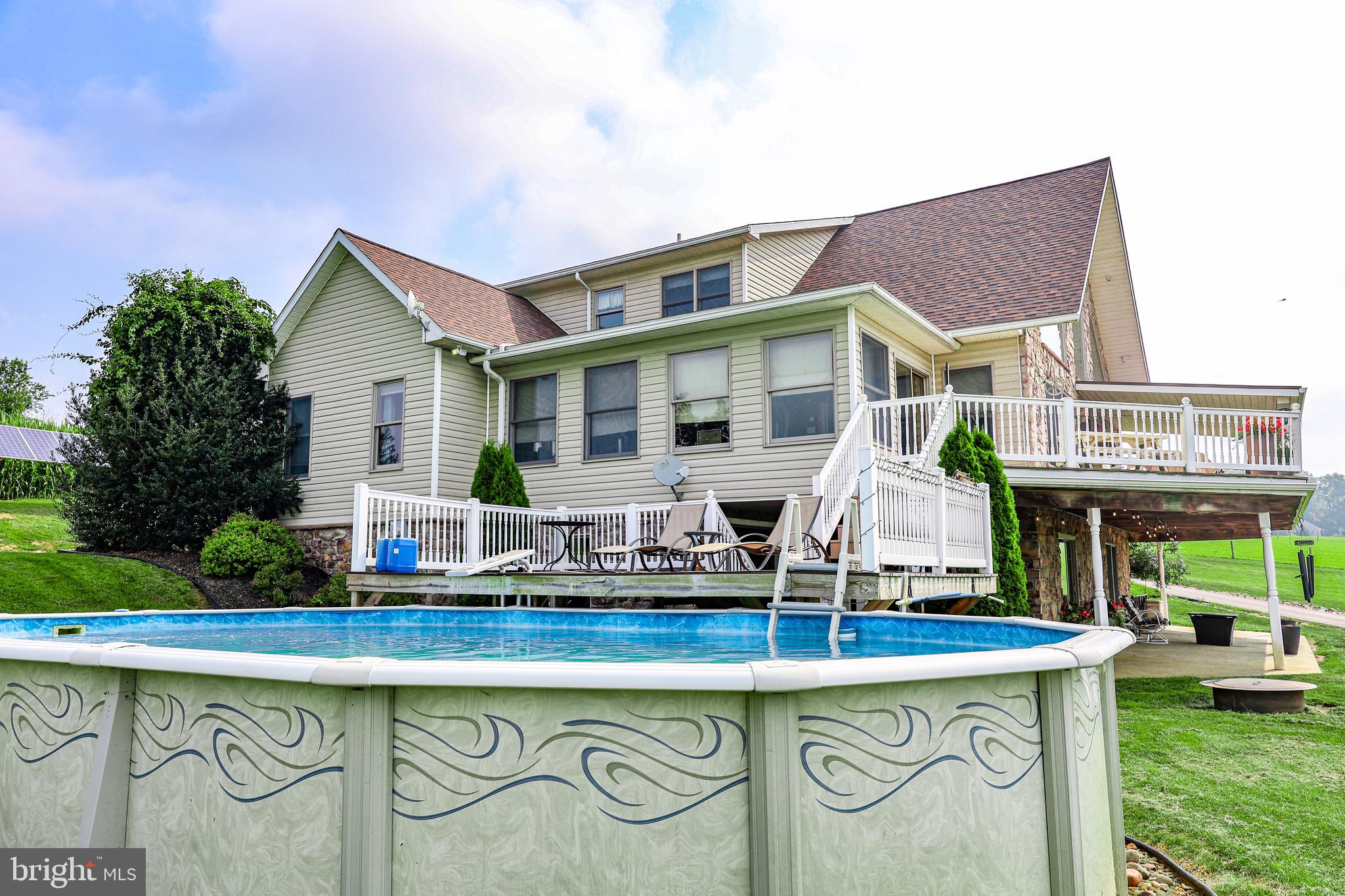 345 Kauffroth Road Narvon, PA 17555 - Photo 79 of 88 a front view of a house with swimming pool and glass windows