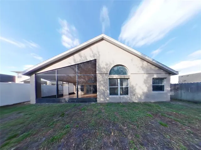 a view of a house with backyard