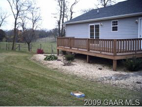 440 Ridge Road Mount Solon, VA 22843 - Photo 3 of 6 a backyard of a house with table and chairs