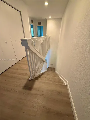a view of entryway with wooden floor