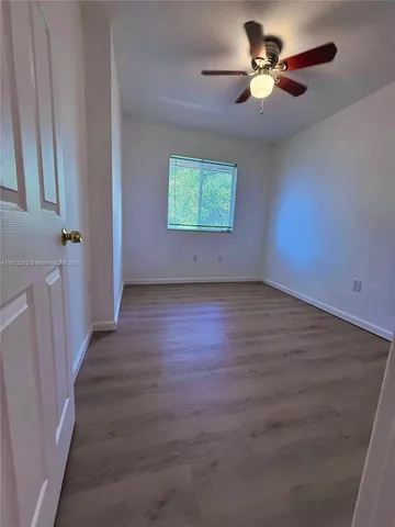 a view of an empty room with a fireplace