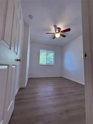 a view of a porch with wooden floor and stairs