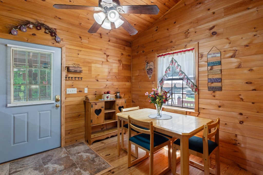 66 Fortenberry Road Young Harris, GA 30582 - Photo 7 of 55 a view of a dining room with furniture window and outside view
