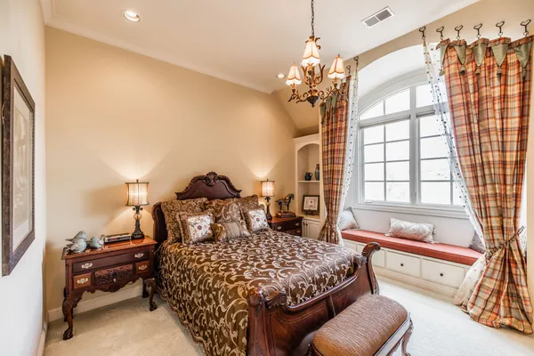 a bedroom with a bed and a couch