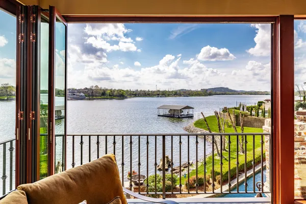 a balcony with view of lake view