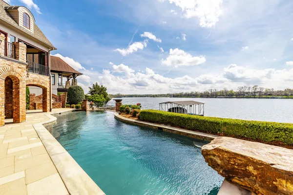 a view of swimming pool with a lounge chair