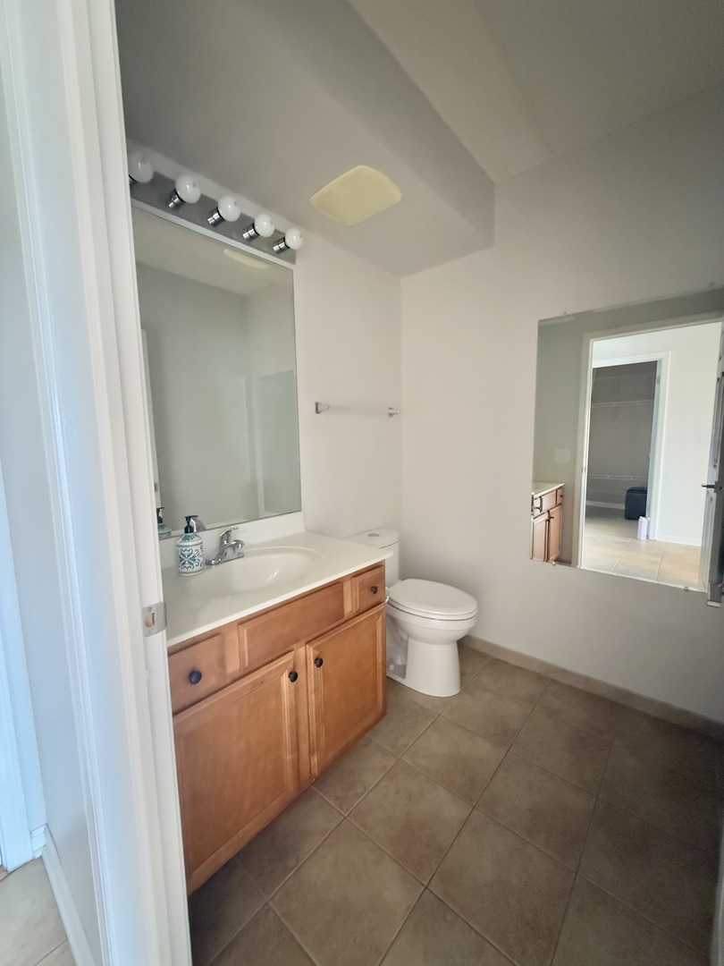 20 South Main Street, Unit 506 Mount Prospect, IL 60056 - Photo 11 of 22 a spacious bathroom with a double vanity sink toilet and a mirror