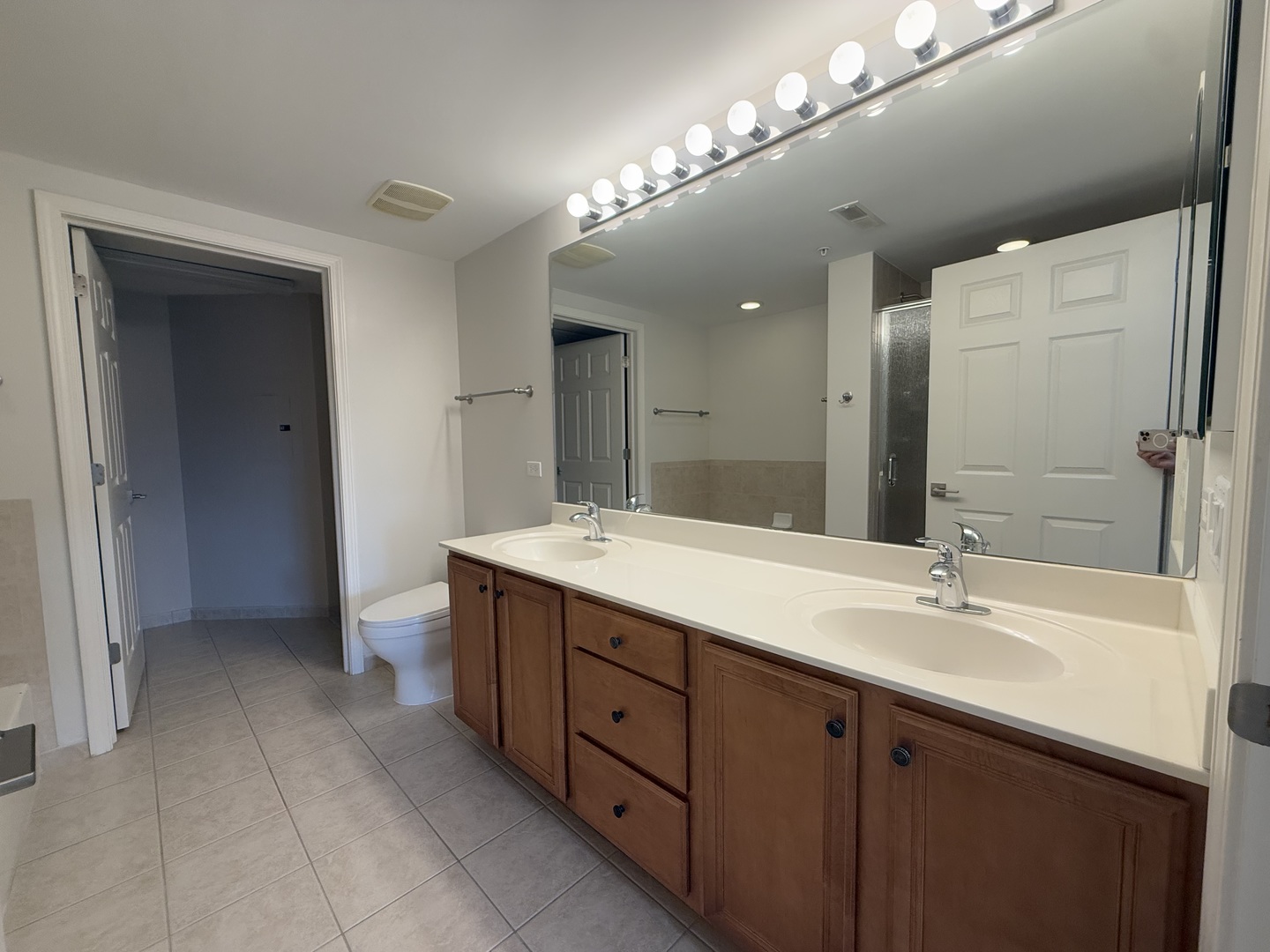 20 South Main Street, Unit 506 Mount Prospect, IL 60056 - Photo 16 of 22 a spacious bathroom with a double vanity sink and a mirror